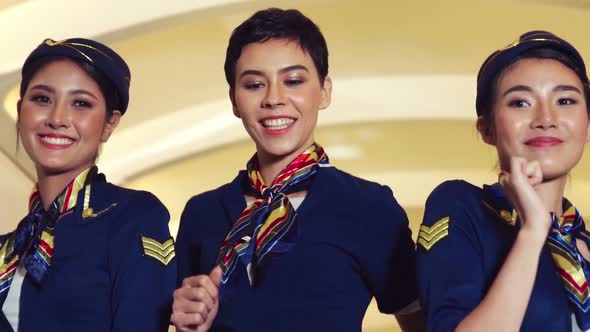 Cabin Crew Dancing with Joy in Airplane alt