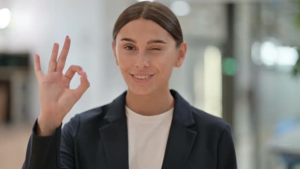 Portrait of Appreciative Businesswoman with Ok Sign By Hand alt