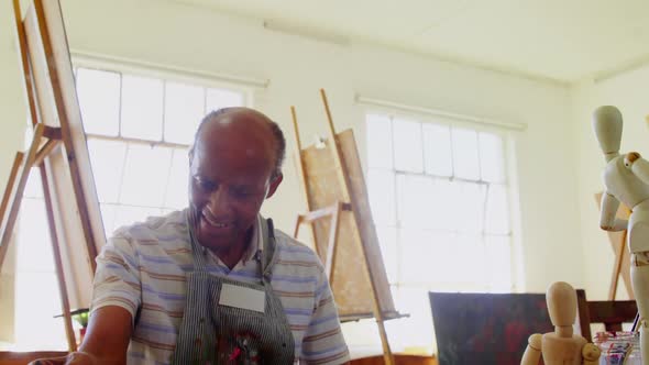 Artist drawing sketch at table alt