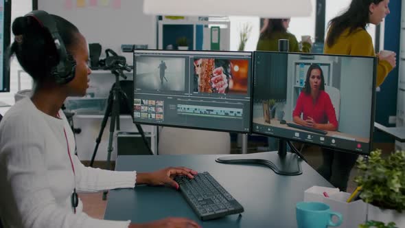 African Woman Editor with Headset Talking During Online Conference alt