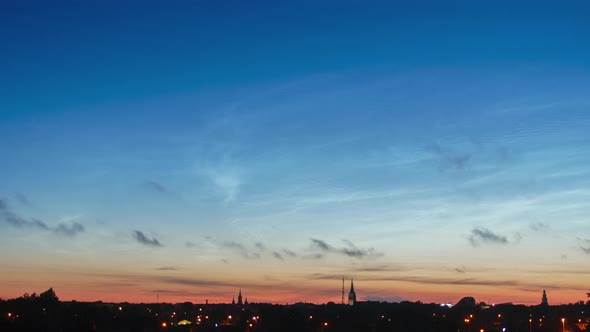 Beautiful time lapse of silvery (noctilucent, polar mesospheric) clouds glowing and shining in a sum alt