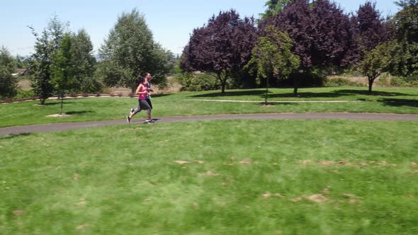 Aerial shot of couple running at park