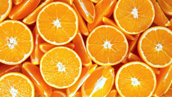 Super Slow Motion Shot of Fresh Orange Juice Splashing Through Orange Slices at 1000Fps alt