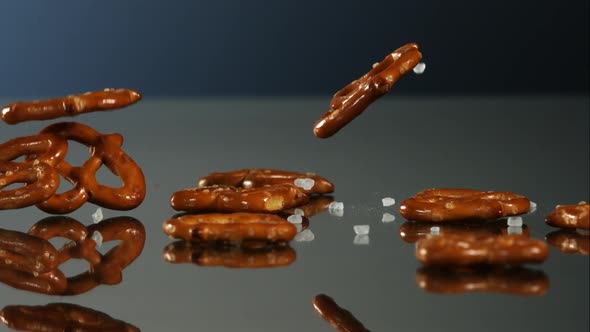 Pretzels falling and bouncing in ultra slow mo 1500fps - reflective surface - PRETZELS PHANTOM  alt