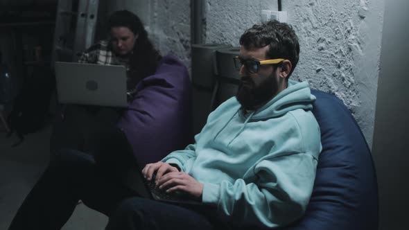 Web Developers in a Shelter During War alt