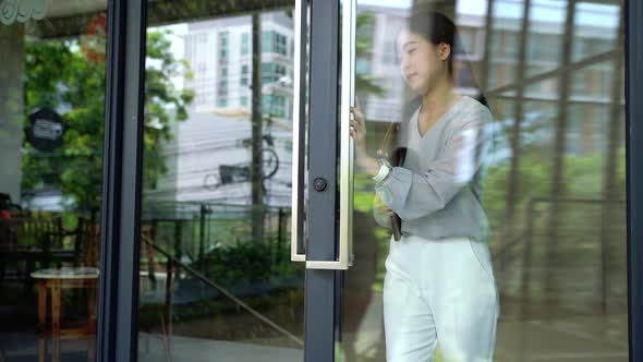 Asian Female Businesswoman Check Time with Watch at Modern Office Building Outside and Run on Rush alt