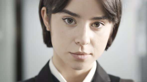 Closeup Face of Confident Coquette Teenage Girl Winking and Smiling alt