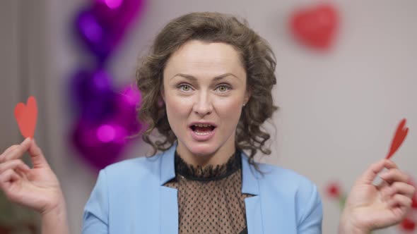 Closeup Portrait of Gorgeous Adult Excited Funny Brunette Woman with Green Eyes Closing with Heart alt