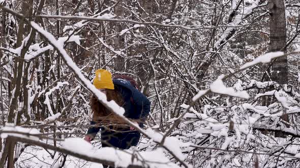 Girl Enjoys in the Winter Snowy Forest alt