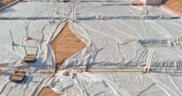 PVC Drain Pipes in a New House in Foundation Slab Preparation for Concrete Pour alt