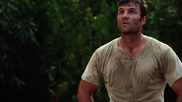 Tired military soldier kneeing at boot camp 4k alt