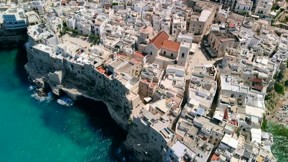 Flying Over Rooftops of Italian City of Polignano a Mare , Apulia alt