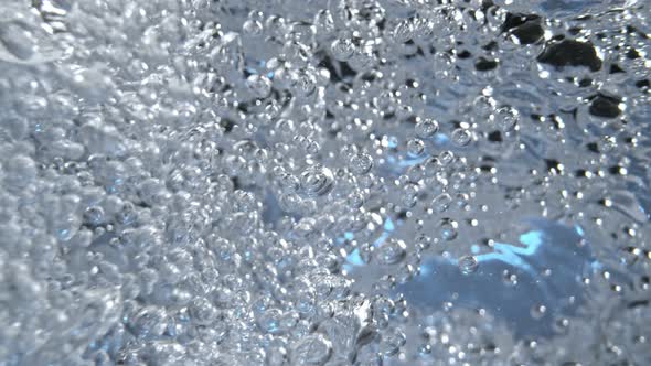 Super Slow Motion Macro Shot of Air Bubbles Flowing in Water at 1000 Fps alt