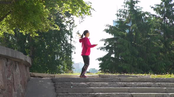 Young Woman Jumping with Skipping Rope Outdoors alt