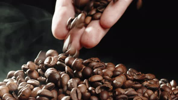 Hand Touching Roasted Coffee Beans alt
