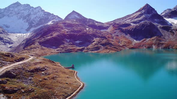 Picturesque Landscape Of Mountain And Tranquil Blue Waters Of Weisssee Lake And Reservoir In Summer alt