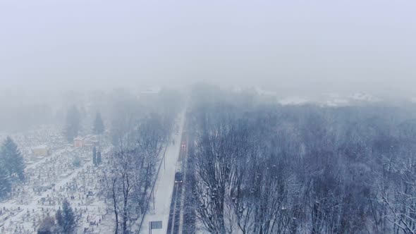 Aerial View of Small Town in Snowfall. Blizzard. Snowstorm.