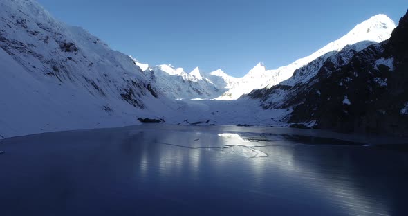 Drone flying over glacier lagoon in Tibet,China.Aerial view drone footage  alt