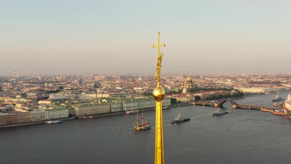The Drone Flies Around the Golden Angel on the Cross of the Peter and Paul Fortress at Sunrise alt