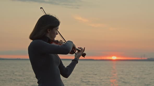 Lady Musician Is Playing Violin Inspired By Sunrise