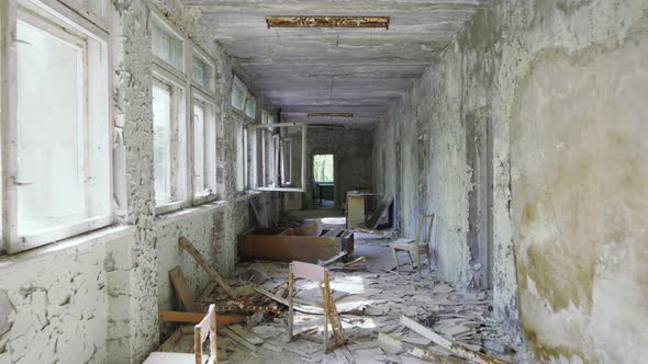 Abandoned And Empty School Hallway With Lots Of Garbage And Peeling Paint On Wall, Chernobyl Exclusi alt