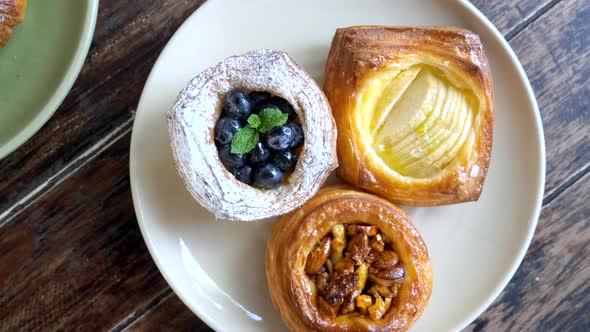 Top View of Pastry on Plates with Teapot and Cup of Coffee Morning Sweet Food alt