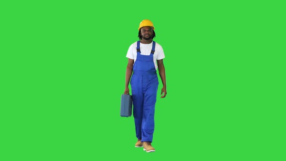 Young Construction Worker Going Off to Work on a Green Screen Chroma Key