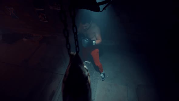 Boxer Trains on A Punching Bag