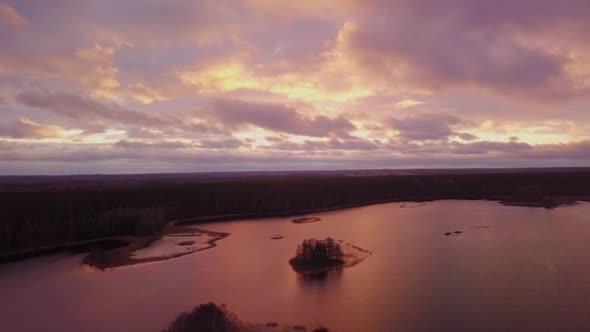 Lake Sunset View with Islands, Aerial Flight Over the Lake