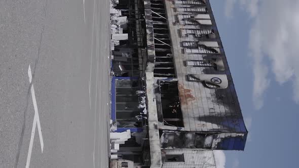 Vertical Video of the Consequences of the War in Ukraine  a Bombedout Shopping Center in Bucha alt