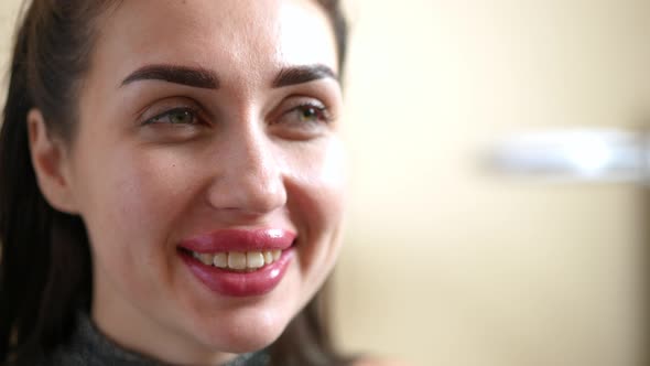 Closeup Portrait of Satisfied Smiling Young Woman with Toothy Smile and Toothbrush Looking Away in alt