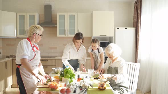 Cheerful Grandmother with Children Cooking Together Having Fun and Talk