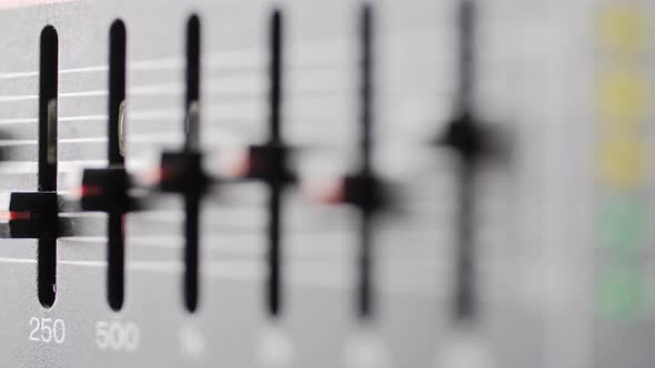 Old dusty audio console closeup. Equalizer. alt