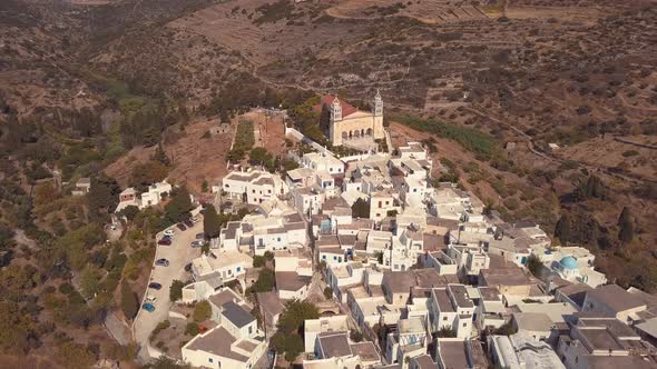 Aerial Drone Shot Pulling Back Slowly over the Agricultural Village of Lefkes Greece alt