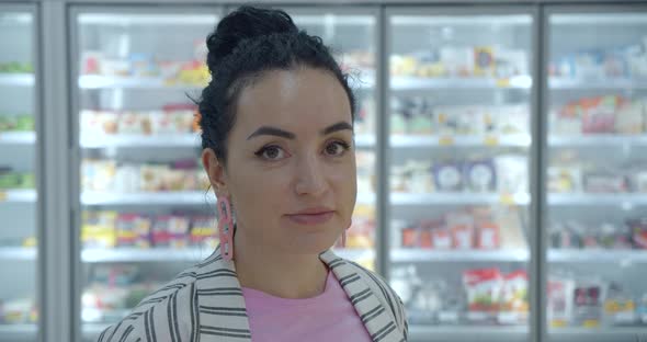 Portrait Young Woman in a the Grocery Department of a Supermarket Is Buying Up Food Concept Where alt