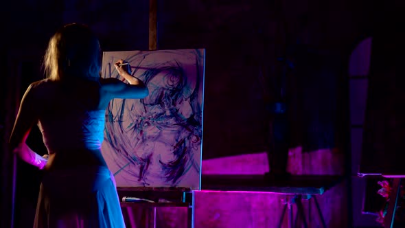 Woman Artist is Drawing Her Selfportrait in Workshop in Night Inspired Talented Lady Painter alt