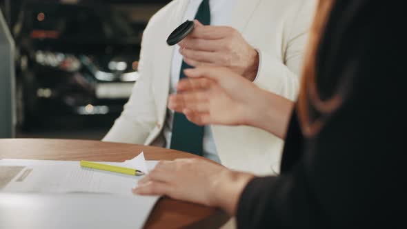 Multi Ethnic Couple Signing Documents About Car Purchasing and Receiving Keys alt