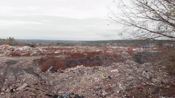Field with big garbage construction dump. Construction waste. Ecological pollution. alt
