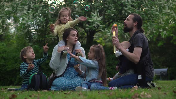 Happy Family Mother Father Three Four Baby Little Siblings Kids Have Fun Blowing Bubbles Enjoying