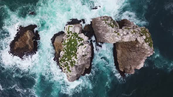 Aerial View of Reefs and Cliffs After Dawn on Arnia Beach. Northern Spain in Summer