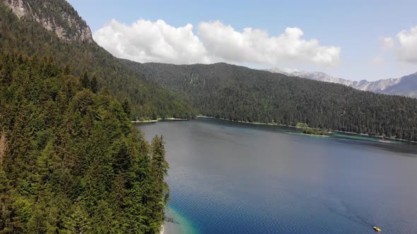 beautiful drone video of an lake and mountains, eibsee in bavaria alt