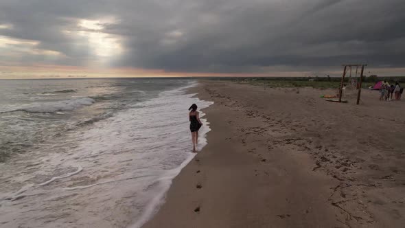Girl Running Along the Sandy Beach