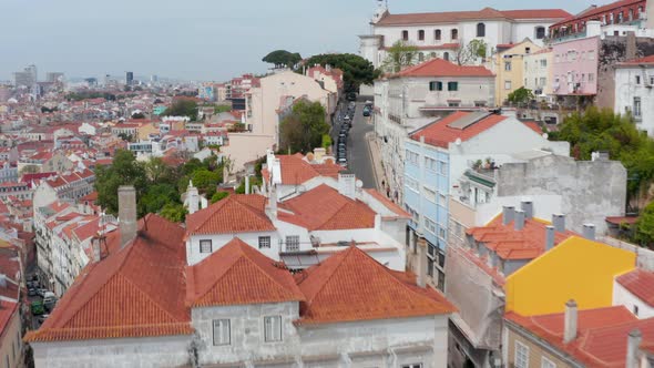 Aerial View of Steep Hills Full of Residential Colorful Houses and Narrow Streets in Urban City alt