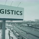 Billboard with LOGISTICS Text at Urban Highway in Winter - VideoHive Item for Sale