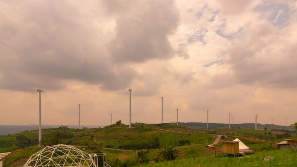 Time-lapse video Windmill generator electric power park Eco power park system. Sunset sky background alt
