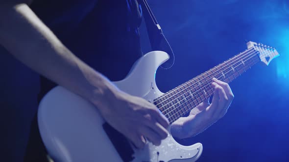 Guitarist`s Hands Playing on Guitar