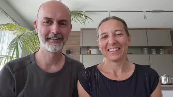 4K Videocall Happy Mature Adult Couple at Home alt