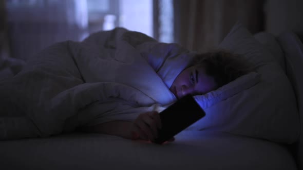 Woman Sleep with Smartphone in Bed