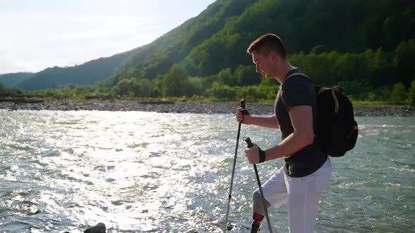 Handicapped Backpacker Against Scenic Mountain Landscape