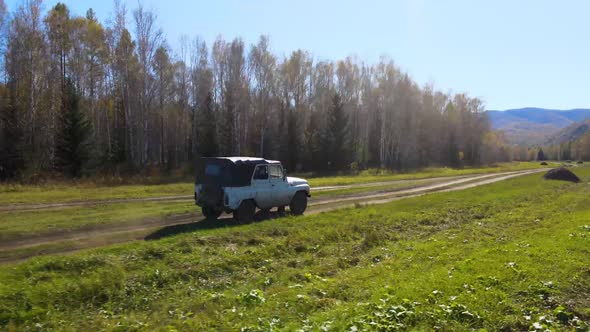 the copter watches the car and then crashes into a tree alt
